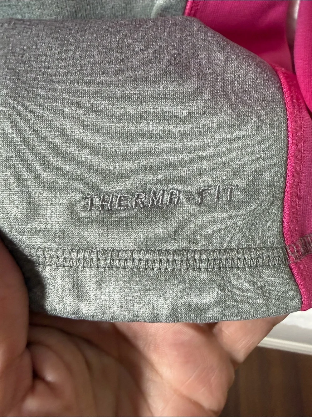 Nike Gray Body Fuchsia Pink Sleeve Hoodie. Be seen in this one 🤩😎